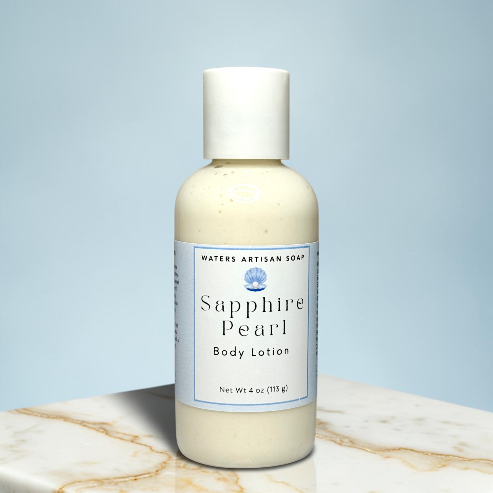 Vegan Body Lotion Handmade With Shea Butter And Aloe Vera Four Ounce Clear Bottle White Flip Top Cap Pale Blue Label Small Batch Skincare Moisturizing Formula Rice Bran Oil Sweet Almond Oil Hydrolyzed Oat Protein Grapefruit Peach Coconut